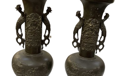 A pair of Japanese bronze Meiji period twin handled vases,...