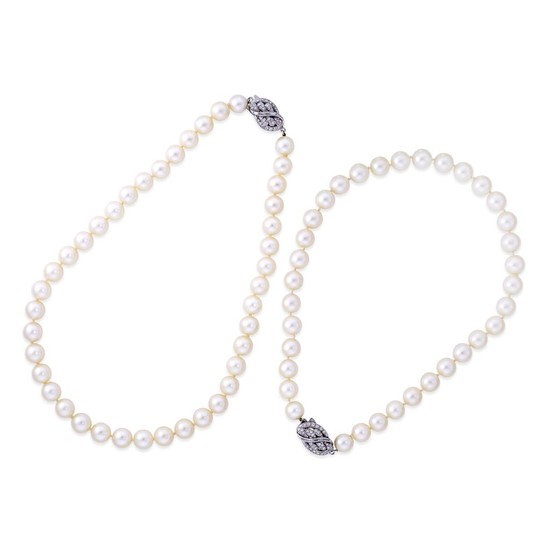 A pair of cultured pearl, diamond, and platinum necklaces...