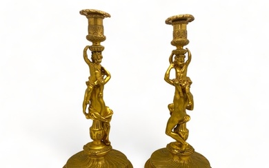 A pair of large 19th century French ormolu candlesticks in t...