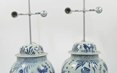 A pair of large Chinese blue and white baluster jars and covers...