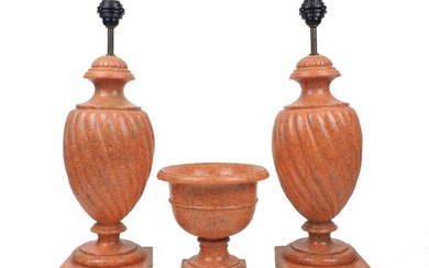 AMENDMENT Please note that VAT is charged on the hammer price for this lotA pair of modern faux marble resin lamps, in the classical style with spiral gadrooned bodies, 60cm high, together with a modern faux marble resin classical style urn, 24cm...