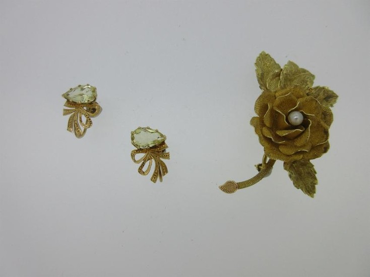 A rose brooch stamped '18k' together with a pair of