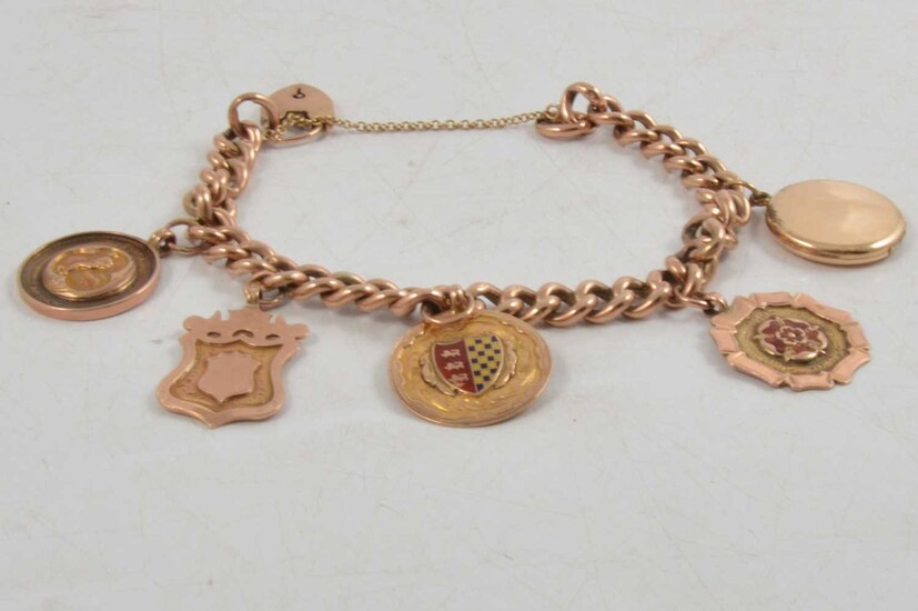 A rose metal bracelet with five medallions, 9ct.