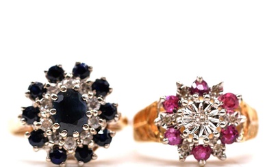 A sapphire and diamond reverse cluster ring and a ruby and diamond reverse cluster ring.