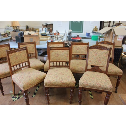 A set of eight late Victorian oak harlequin dining chairs, t...