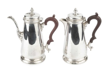 A silver coffee pot and matching hot water pot, with...