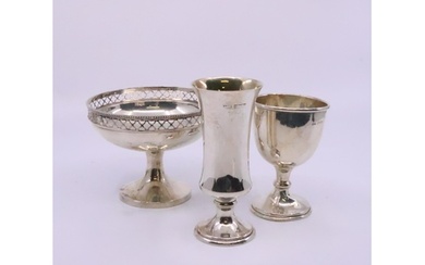 A silver footed dish, a silver egg cug and a small silver go...