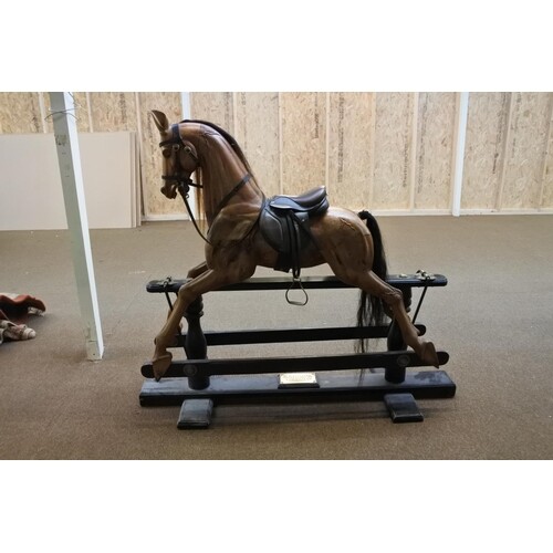A stunning hand carved limited edition glider rocking horse,...