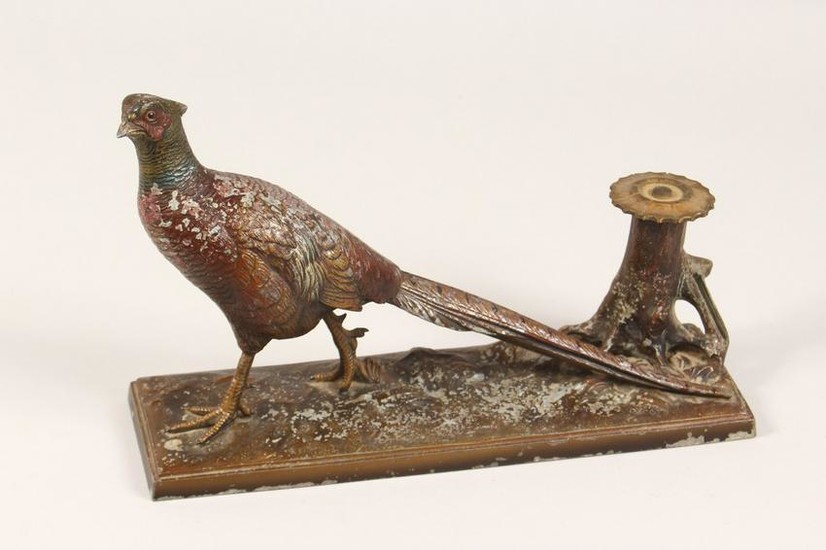 AN EARLY 20TH CENTURY PAINTED SPELTER TABLE LIGHTER, in