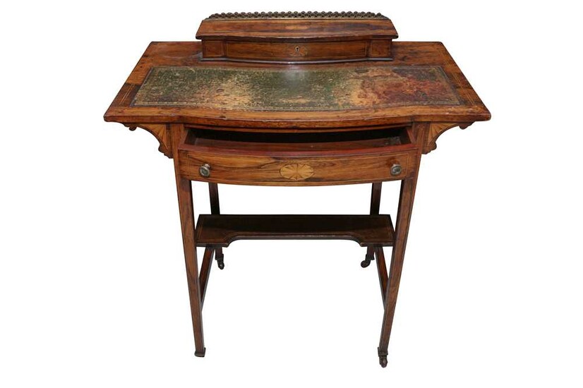 AN EDWARDIAN SHERATON REVIVAL ROSEWOOD BOW FRONT WRITING TABLE