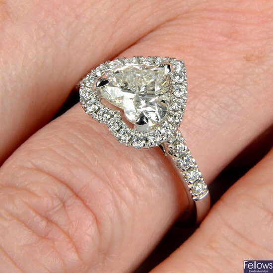 An 18ct gold laser-drilled heart-shape diamond single-stone ring, with brilliant-cut diamond surround and shoulders.