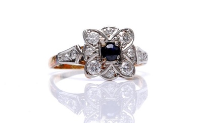 An 18ct sapphire and diamond cluster ring, central sapphire ...