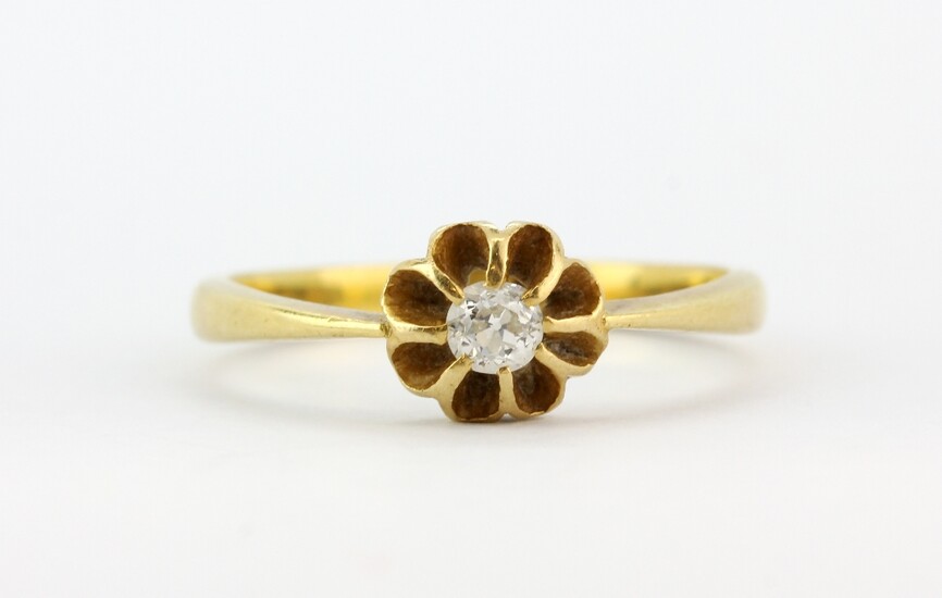 An 18ct yellow gold solitaire ring set with an old cut diamond, (M.5).