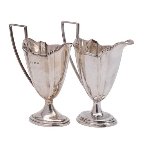 An Edward VII silver pedestal cream jug, maker William Aitke...