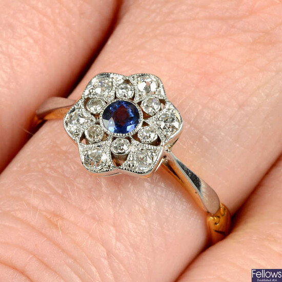 An Edwardian gold and platinum sapphire and single-cut diamond openwork floral cluster ring, with replacement half-band.