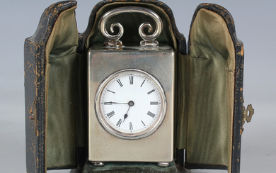An Edwardian silver rectangular cased carriage timepiece, the circular enamel dial with Roman hour n