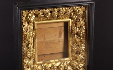 An Elaborate 19th Century Open-Carved Giltwood Icon Frame. The rectangular aperture 12'' x 10'' (30.