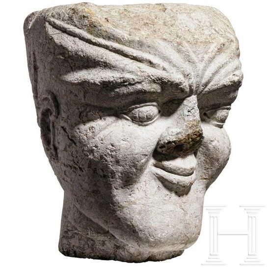 An Italian limestone capital in the shape of a head