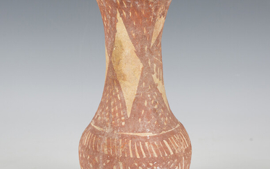 An ancient pottery vase, possibly Mesopotamian, the exterior and rim interior painted with red linea