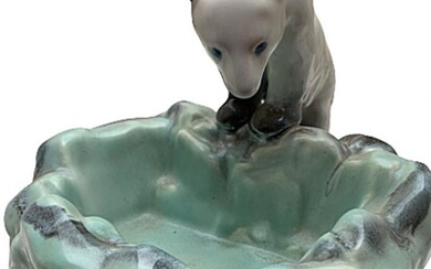 An earthenware ashtray, in the form of a standing polar bear. Czechoslovakia. H. 19. W. 22 cm.