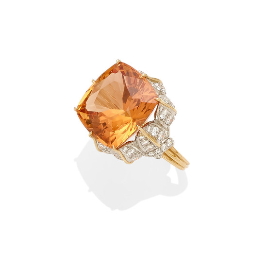 An imperial topaz and diamond ring