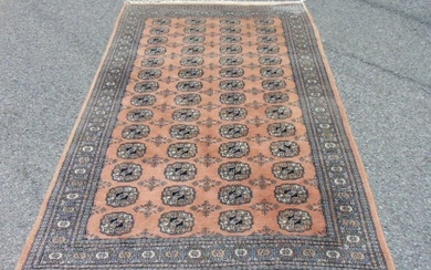 Bokhara carpet, salmon colored, rug is 5'4" by 8'