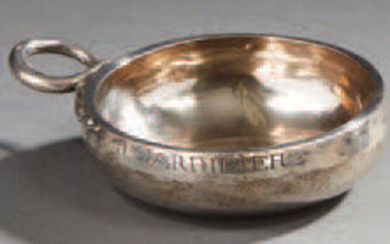 Burgundian silver tastevin with gadroon decoration, resting on...