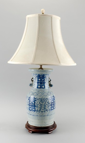 CHINESE BLUE AND WHITE PORCELAIN VASE MOUNTED AS A TABLE LAMP Foo dog handles at sides of neck. Height to finial 30".