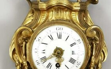 Cartel clock, brass fire gilde