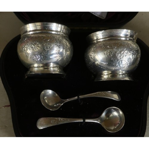 Cased pair of London silver hallmarked salts with blue glass...