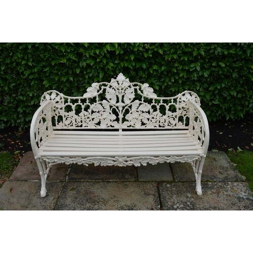 Cast iron garden seat decorated with oak leaves. { 100cm H X...
