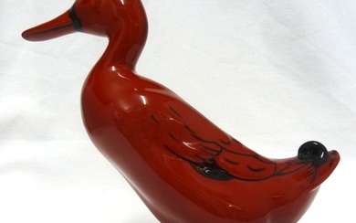 Charles Noke for Royal Doulton - a red flambe pottery figure...