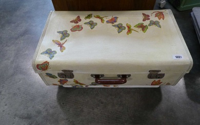 Decorated suitcase on standDecorated suitcase on stand