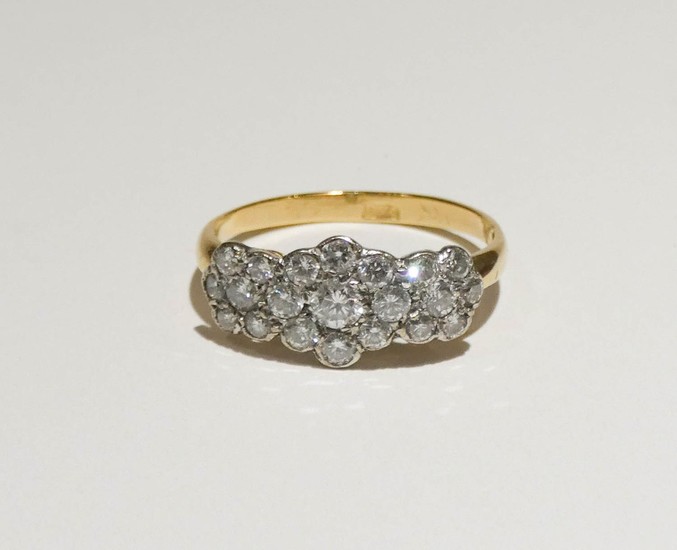 Diamond cluster ring, pave set with a triple flower head clu...