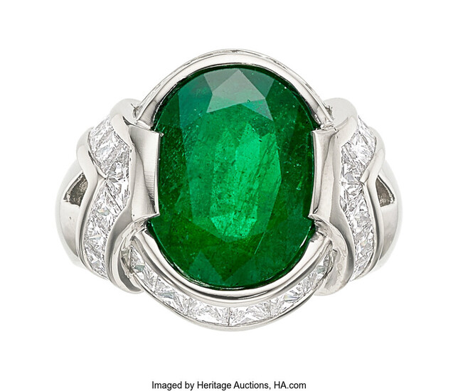 Emerald, Diamond, Platinum Ring The ring features an oval-shaped...