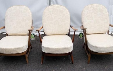 Ercol: Three mid 20th century easy arm chairs with fabric...