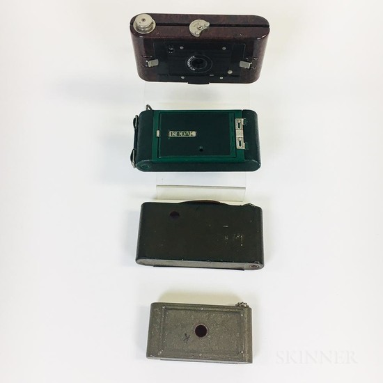 Four Folding Colorful Kodak Cameras, a Vest Pocket Rainbow Hawk-eye in lavender, a Pocket Junior No. 1 in green, a Rainbow Hawk-eye No.