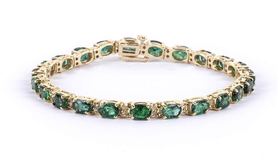 Gold and emeralds tennis bracelet 14k yellow gold, set...