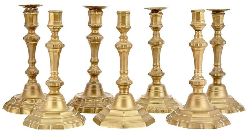 Group of Seven Similar Continental Brass Candlesticks