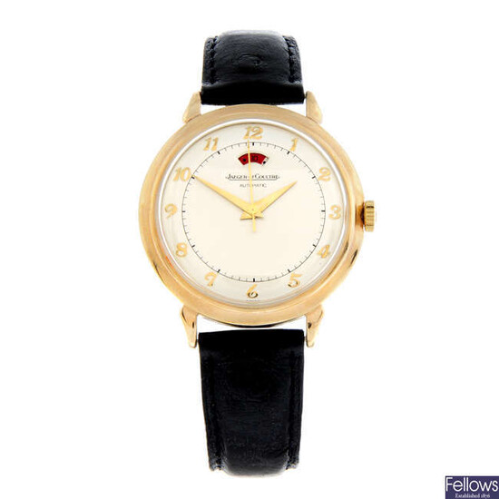 JAEGER-LECOULTRE - a 9ct yellow gold Powermatic wrist watch, 35mm.
