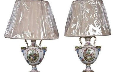 Pair of paint decorated porcelain lamps. Possible Meissen. The fronts depicting a finely done genre