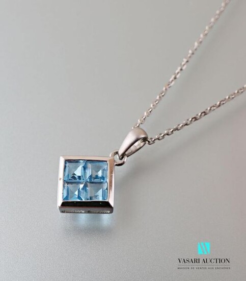 Pendant and its chain with chainmail forçat, the pendant of rhombus shape set with four calibrated blue topazes, the brushed bélière.