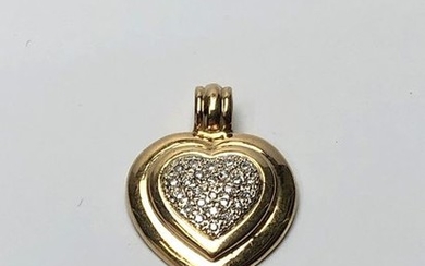 Pendant heart in yellow gold, the center paved...