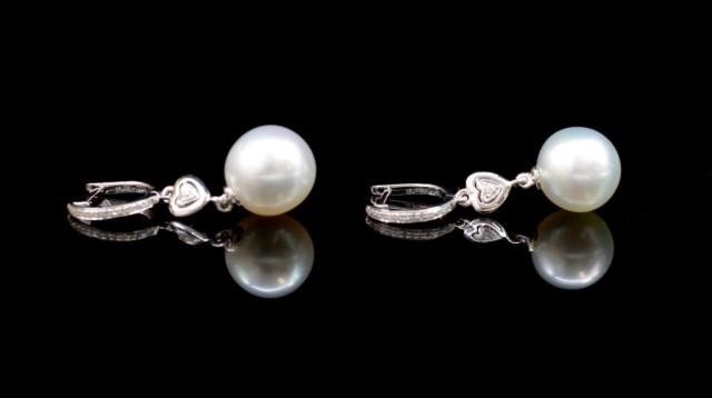 South sea pearl and 18ct white gold earrings with pave diamo...