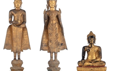 Two gilt bronze standing Buddha and a lacquered and gilt wood seated Buddha, Thailand, Tallest H 121 cm