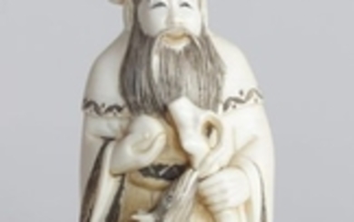 OKIMONO en ivoire représentant le dieu Jurojin deb…