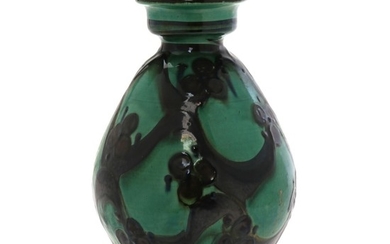 Kähler: A round earthenware vase decorated with brown and blue glazed motifs on a green base. H. 27 cm.