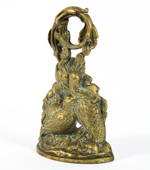 A 19th century brass door stop, cast with two partridges amongst scrolling foliage, height 29.