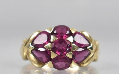 A 9ct Gold and Garnet Cluster Dress Ring Comprising Oval and...
