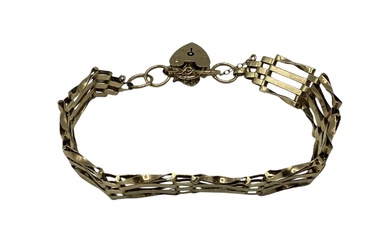 A 9ct gold gate link bracelet with 9ct gold...